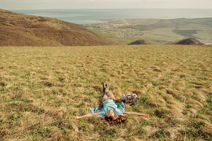 Happy hiker woman lying