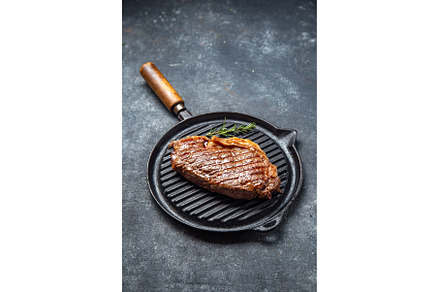 Fried strip loin steak on vintage, a Food & Drink Photo by LARISA BLINOVA
