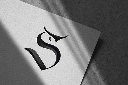 S logotype with OWL face
