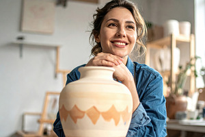 Smiling Woman Holding Decorative Ceramic Vase, an Arts & Entertainment Photo by Davizro's Market