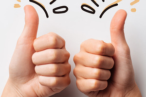 Thumbs up gesture with decorative elements, a Business Photo by AlyaAnd