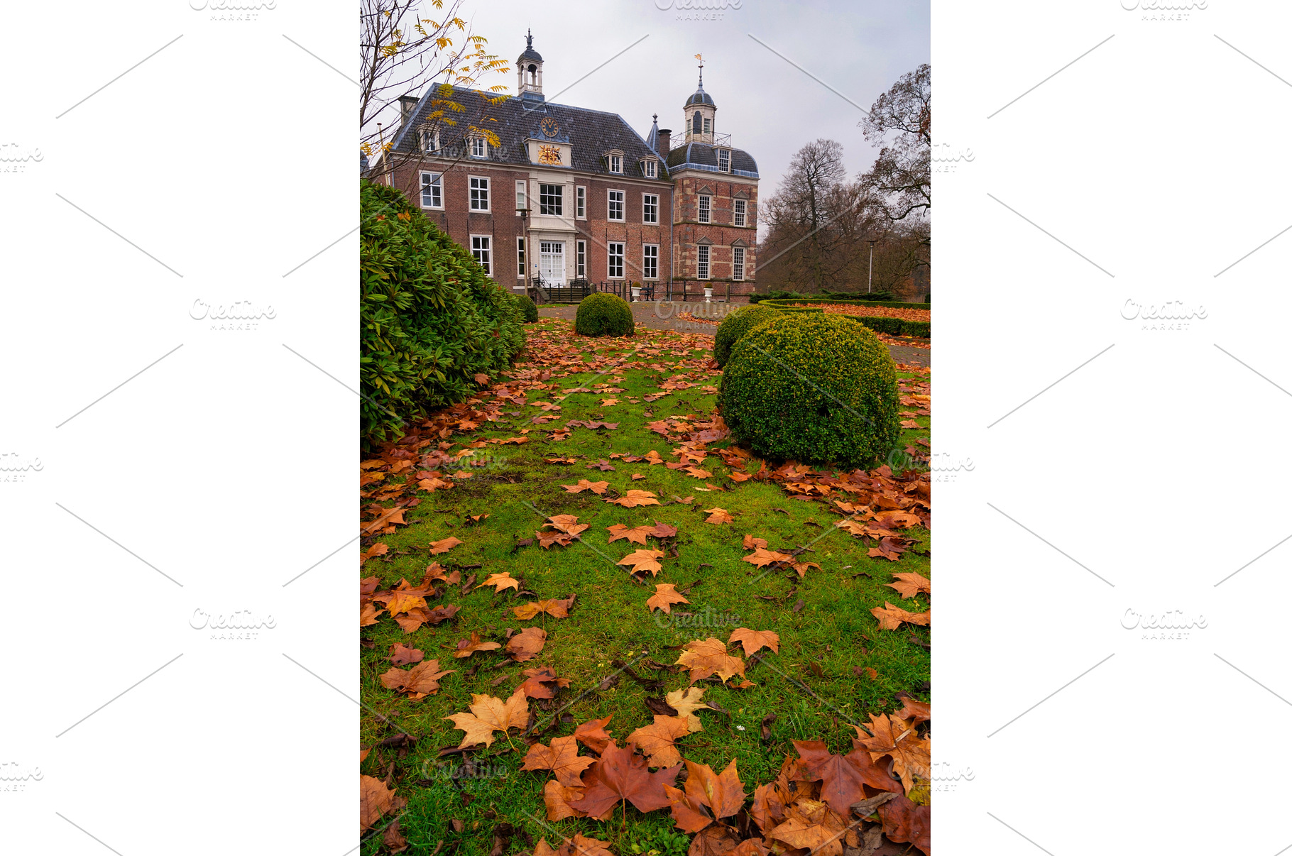Fallen leaves in front of a, an Architecture Photo by John Stuij Photography