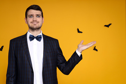 Concept of Halloween, young man on yellow background, a Person Photo by AtlasStudio PRO
