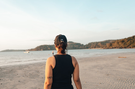Woman walking along the beach in the evening, a Nature Photo by Art Rachen