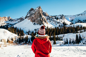 Woman Standing in Front of Mountain