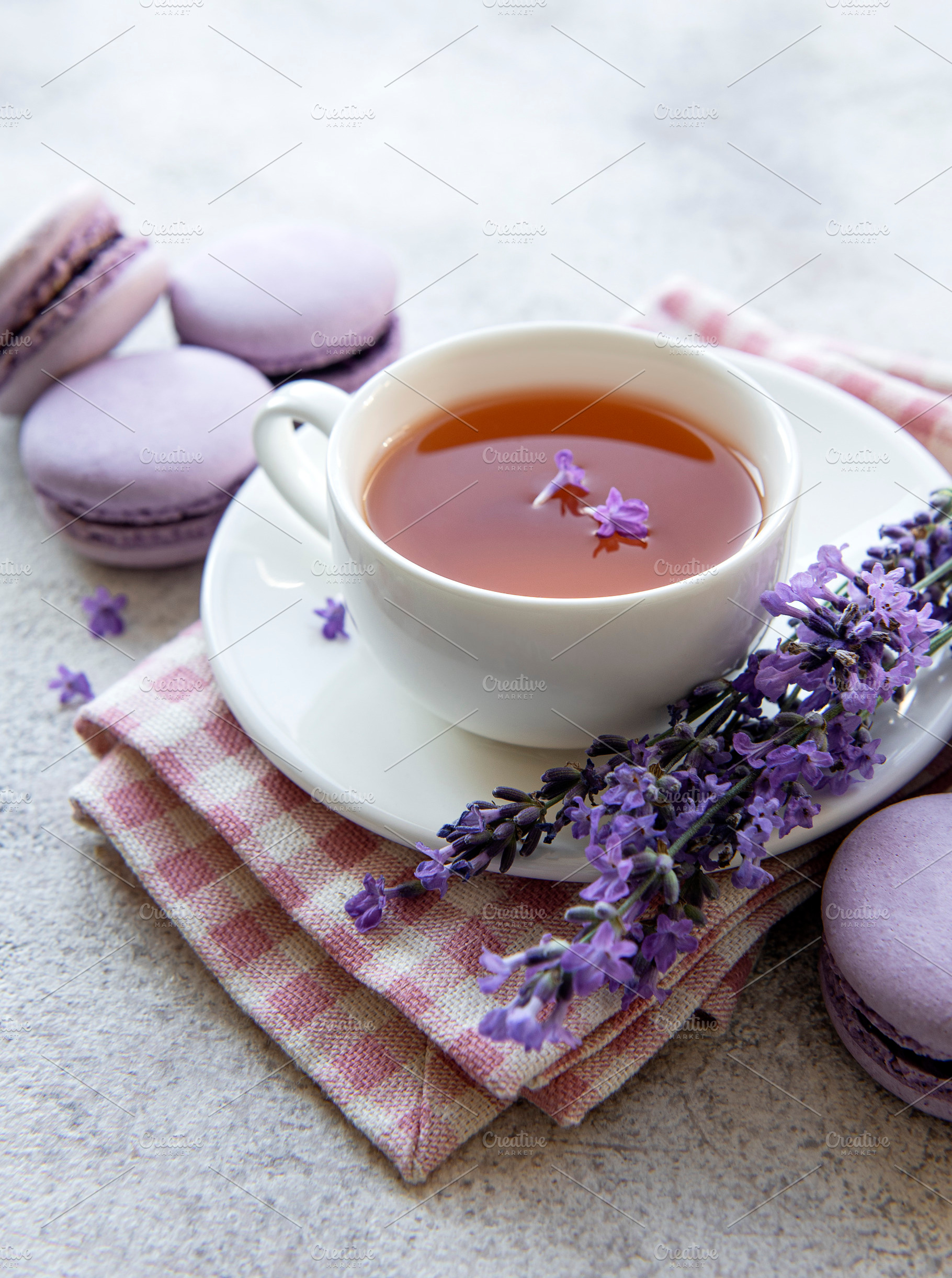 Cup of tea with macaroon dessert with lavender flavor, a Food & Drink Photo by Olena Rudo