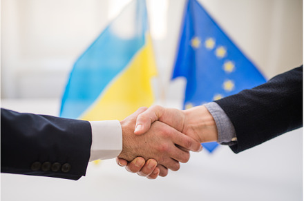 Handshake between the European Union, a Business Photo by HalfPoint