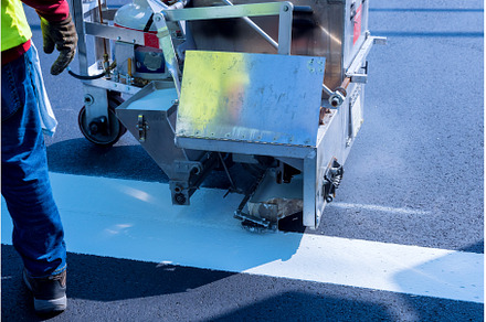 Workers apply a road marking to the, an Industrial Photo by Ungvar Studio