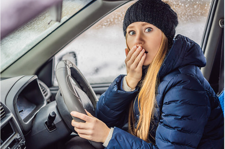 Woman in a car during a snowfall, a Transportation Photo by Elizaveta Galitskaya