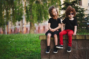 Boy and girl on the street containing boy, girl, and kids