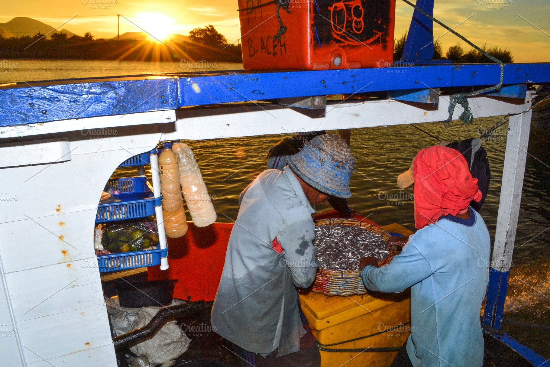 Fishermen Sorting Fish, a Nature Photo by bastera