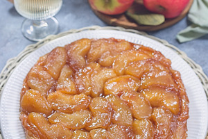 Caramelized apple Tart Tartin on plate, french upside down cake, vertical, a Food & Drink Photo by iuliia_n