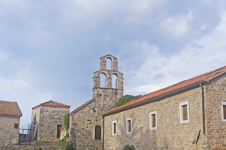Narrow stone street with a big tower, an Architecture Photo by Photo by YuraYaryna