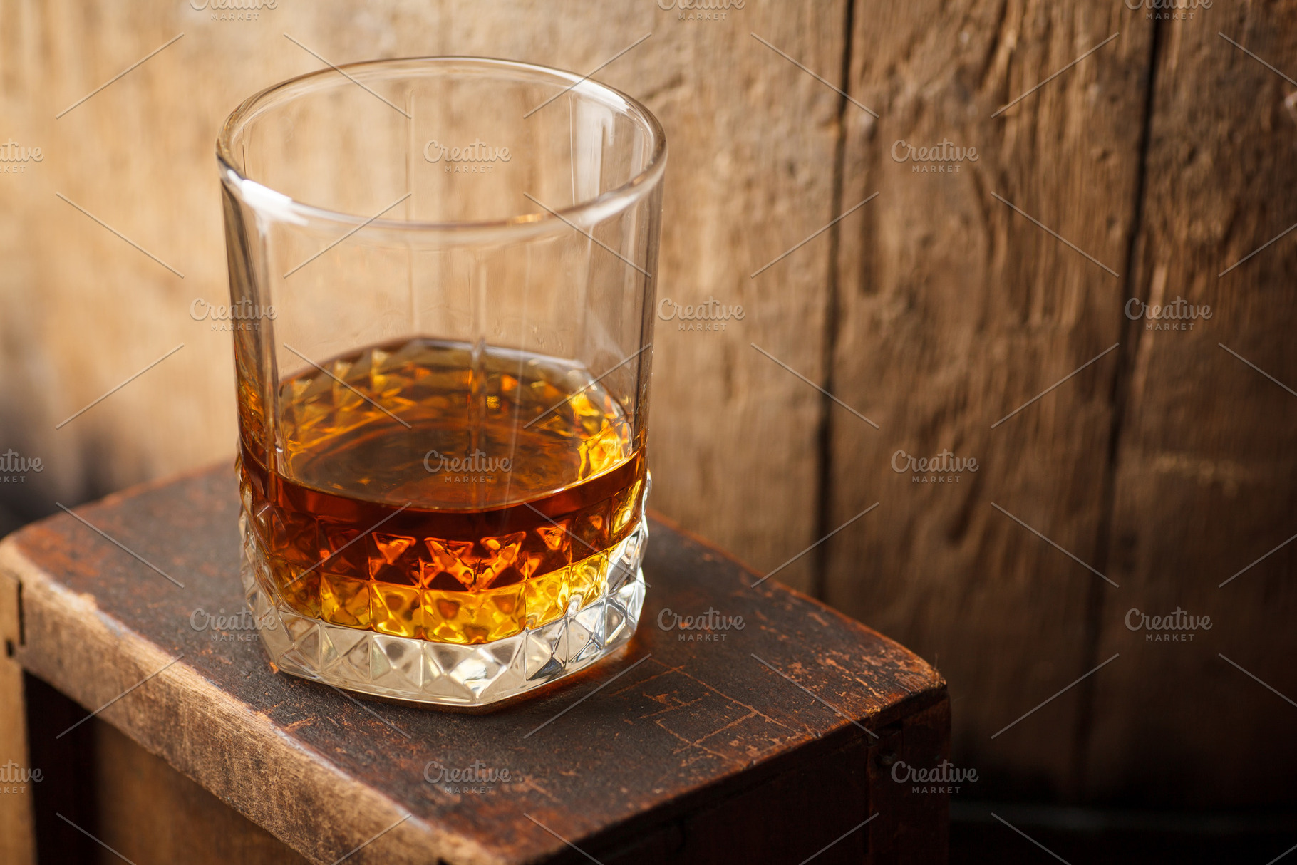 Glass of whiskey near a barrel featuring alcohol, barrel, and cask, a Food & Drink Photo by Hidden Hallow