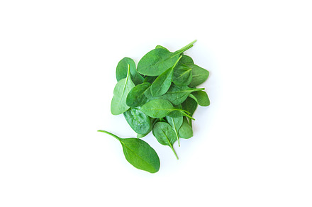 Spinach leaves isolate on white, a Food & Drink Photo by yanadjana