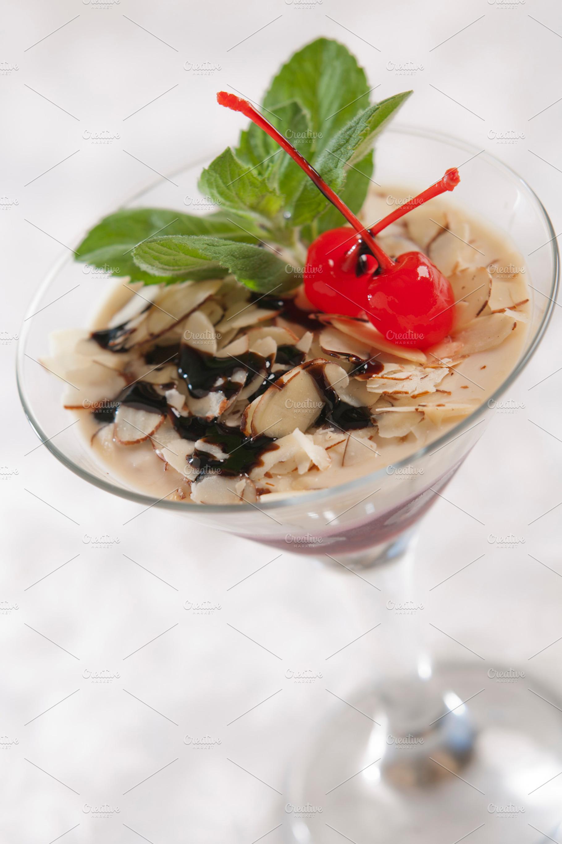 Dessert in a glass containing glass, dessert, and transparent