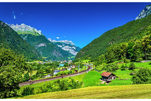 View of erstfeld a village in swiss alps containing mountain, switzerland, a Transportation Photo by Leonid Andronov