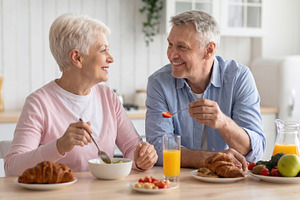 Senior Couple Enjoying Healthy Breakfast Together, a Person Photo by Davizro's Market