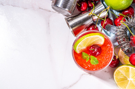 Cherry and lime alcoholic booze cocktail, a Food & Drink Photo by Rimma