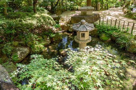 Stone lantern and fountain at Mitaki-Dera temple in Hiroshima, J