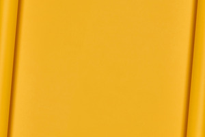 Yellow paper background with curled edges, vertical layout, a Background Photo by ndanko