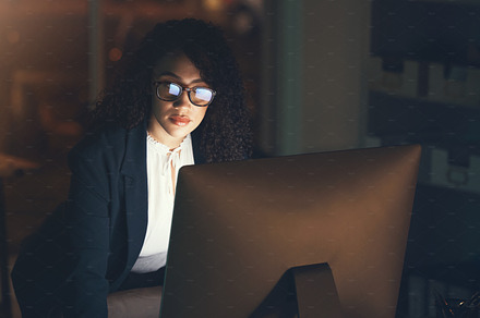 Business, office and black woman on computer at desk for project, strategy report and reading email. Corporate manager, overtime and female standing done working on schedule, planning and research, a Photo by Peopleimages.com