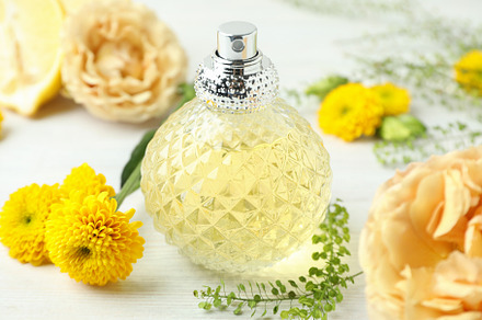 Concept of natural perfume on white wooden table, a Beauty & Fashion Photo by AtlasStudio
