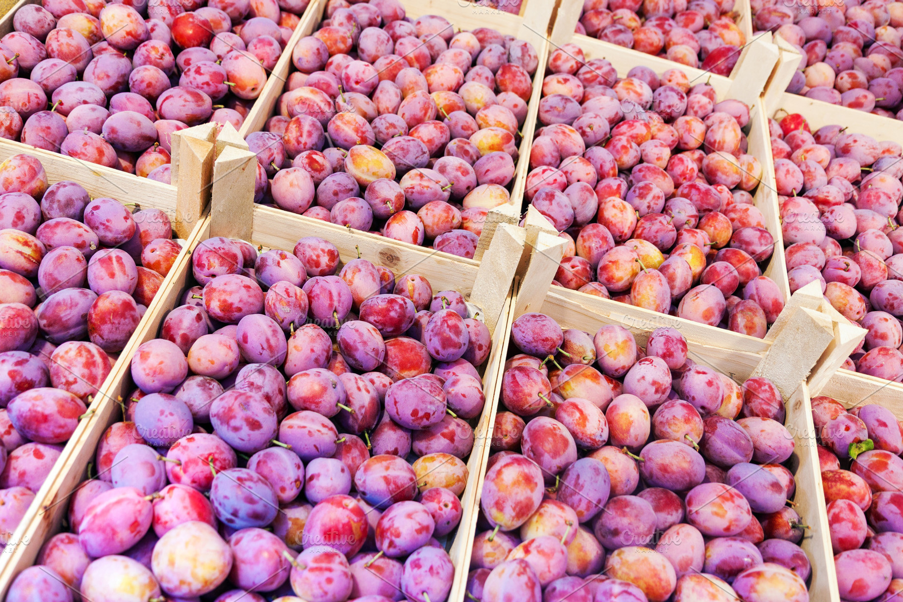 Fresh plum fruits in wooden boxes, a Food & Drink Photo by BOOCYS