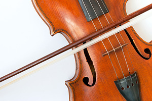 Violin with bow featuring violin, bow, and cu
