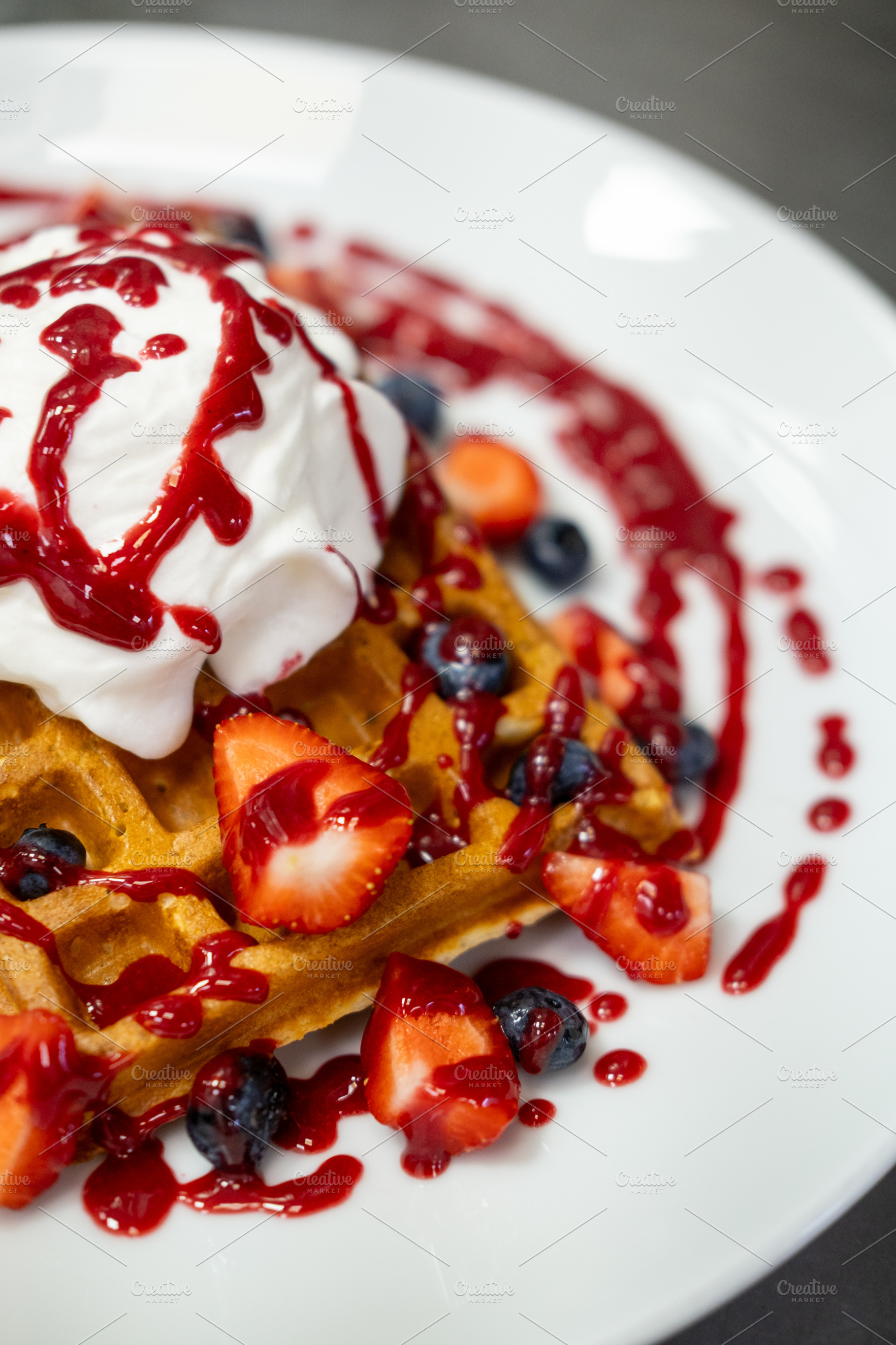 Belgian waffles sweet dish cream strawberry sauce, a Food & Drink Photo by Photo Drive Studio