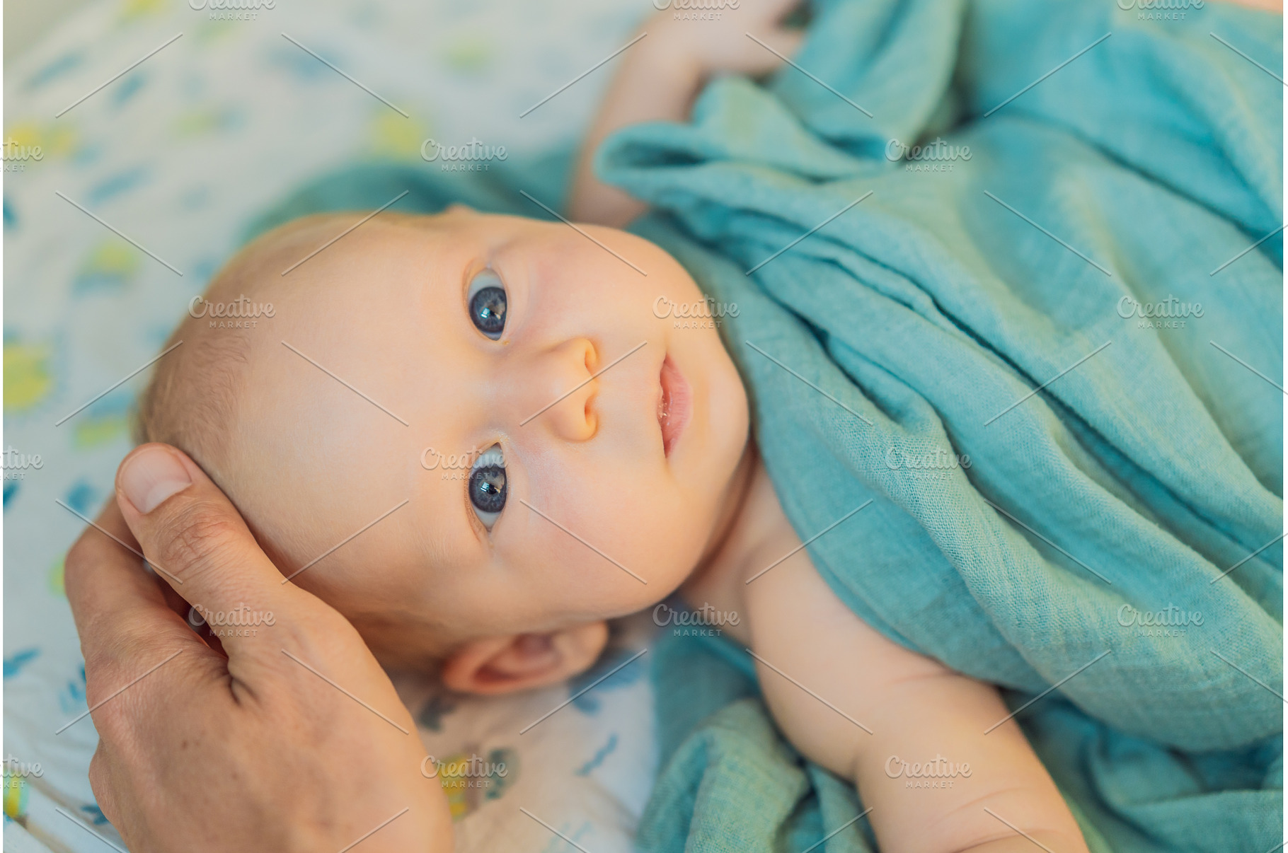 Father gently stroking his newborn, a Person Photo by Elizaveta Galitskaya