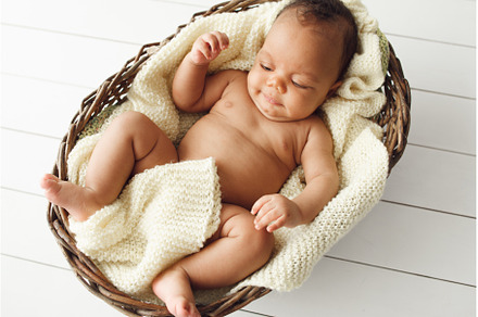 Newborn african baby in wicker, a Person Photo by Photo Drive Studio