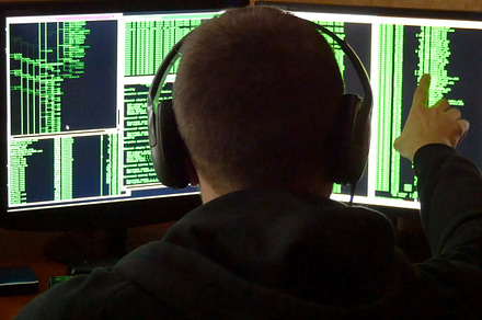 Hacker is looked to binary code criminal hacker penetrating network system, a Technology Photo by Footage Autor