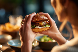 Enjoying a burger at dinner time, a Photo by Beautiful things