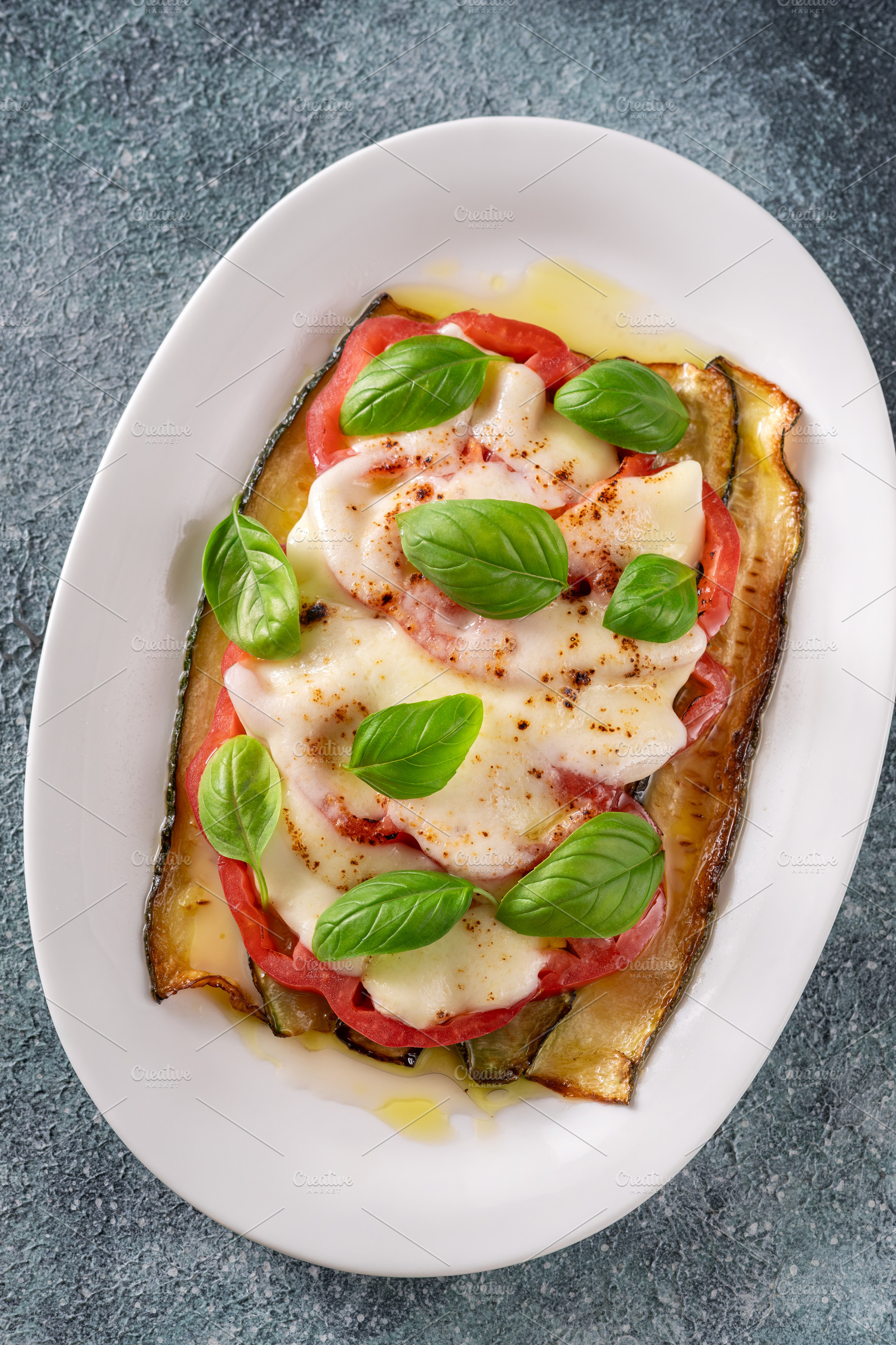 Grilled Zucchini With Tomato Torched Mozzarella Basil On Elegant, a Food & Drink Photo by Alexander Prokopenko