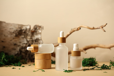 Transparent dropper bottles with natural cosmetics and jar of moisturizers crea, a Beauty & Fashion Photo by photoguns