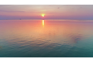 Tropical sunset reflecting on calm, a Nature Photo by Goinyk