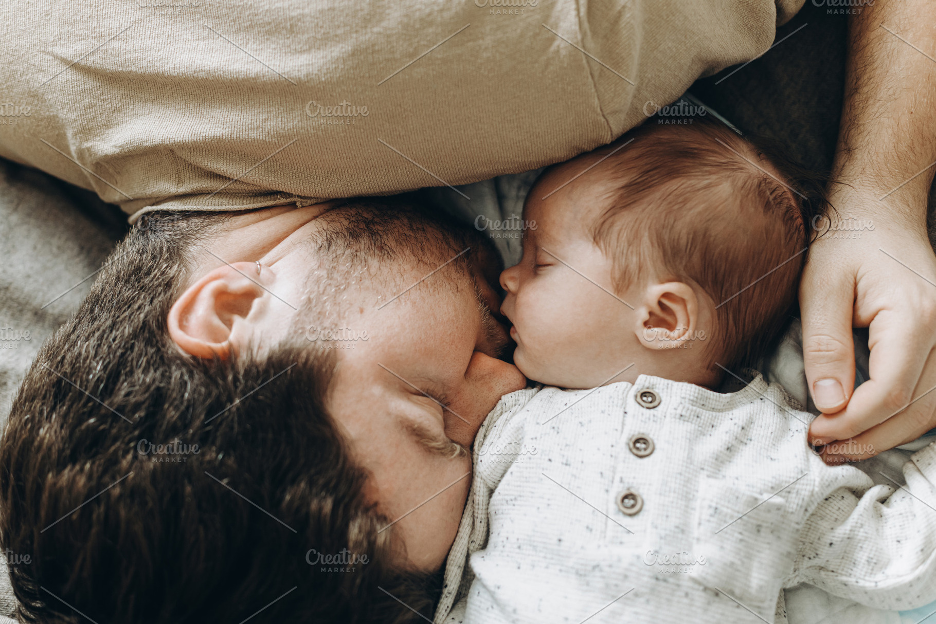 Happy Fathers day! Father sleeping together with little baby son, a Person Photo by Sonjachni