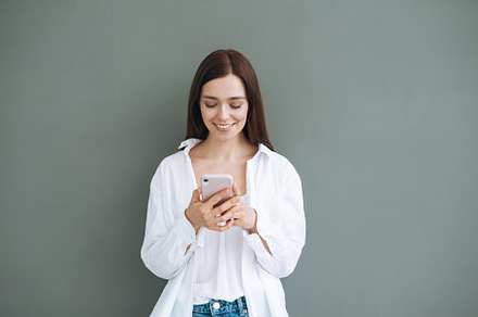 Portrait of young woman with mobile, a Person Photo by Galina_Zhigalova