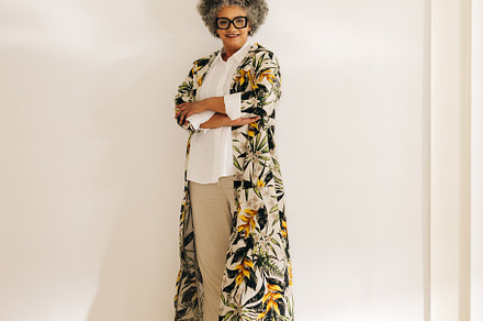 Mature businesswoman standing against an office wall, a Person Photo by Jacob Lund