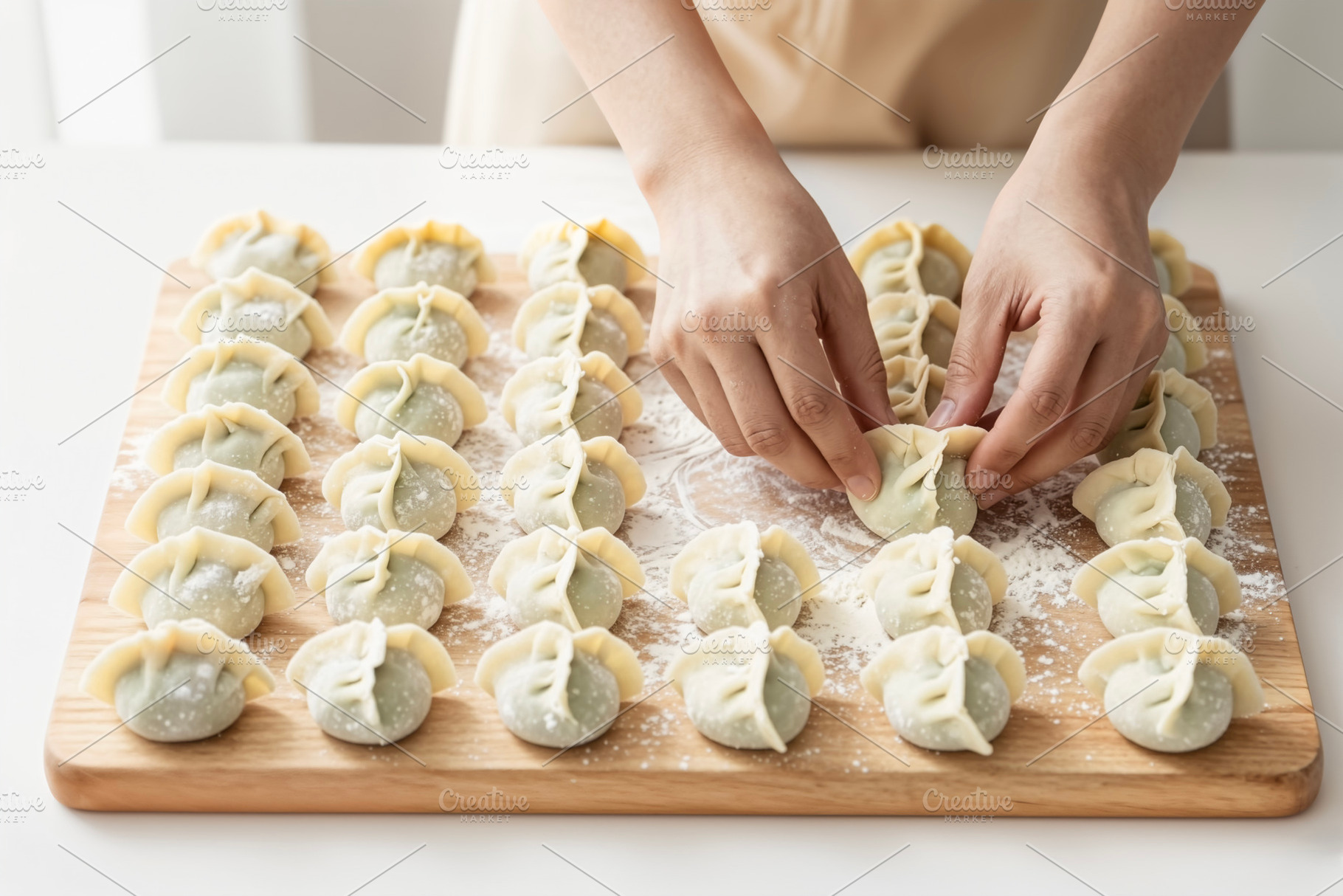 Hands Arranging Raw Homemade Dumplin, a Photo by rarrarorro