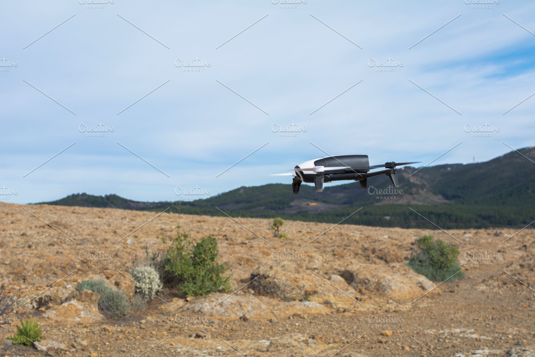 Drone flying containing landscape, desert, and sky, a Technology Photo by RaquelVizcaíno