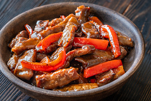 Chinese Beef Stir Fry With Red Peppers In Rustic Earthenware Bow, a Food & Drink Photo by Alexander Prokopenko