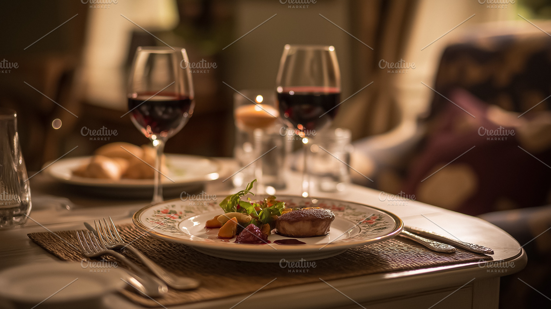Romantic fine dining setting with gourmet meal and red wine glasses at an elega, a Food & Drink Photo by Studio ANNA