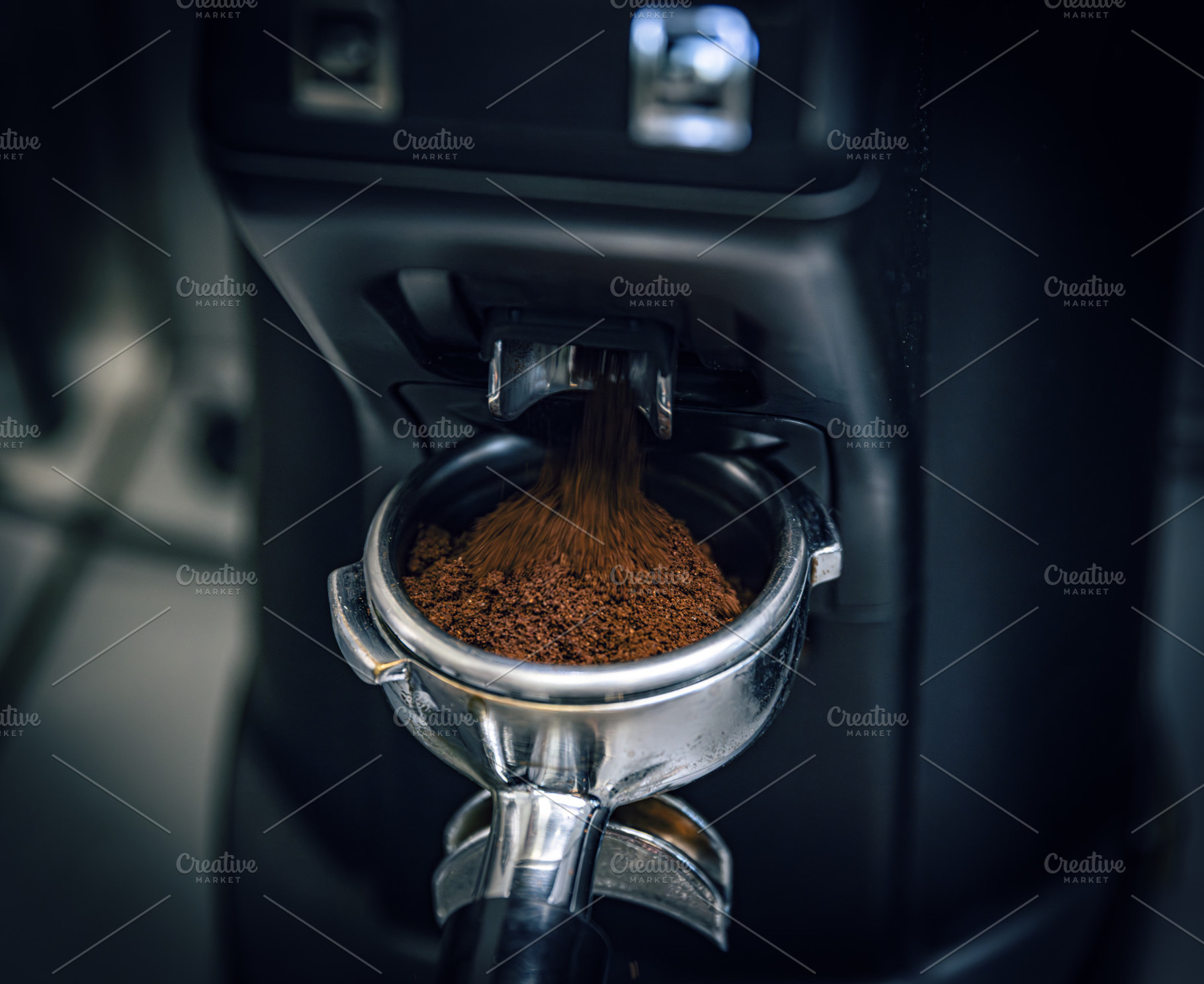Coffee machine grinding coffee beans, a Photo by Grafvision photography