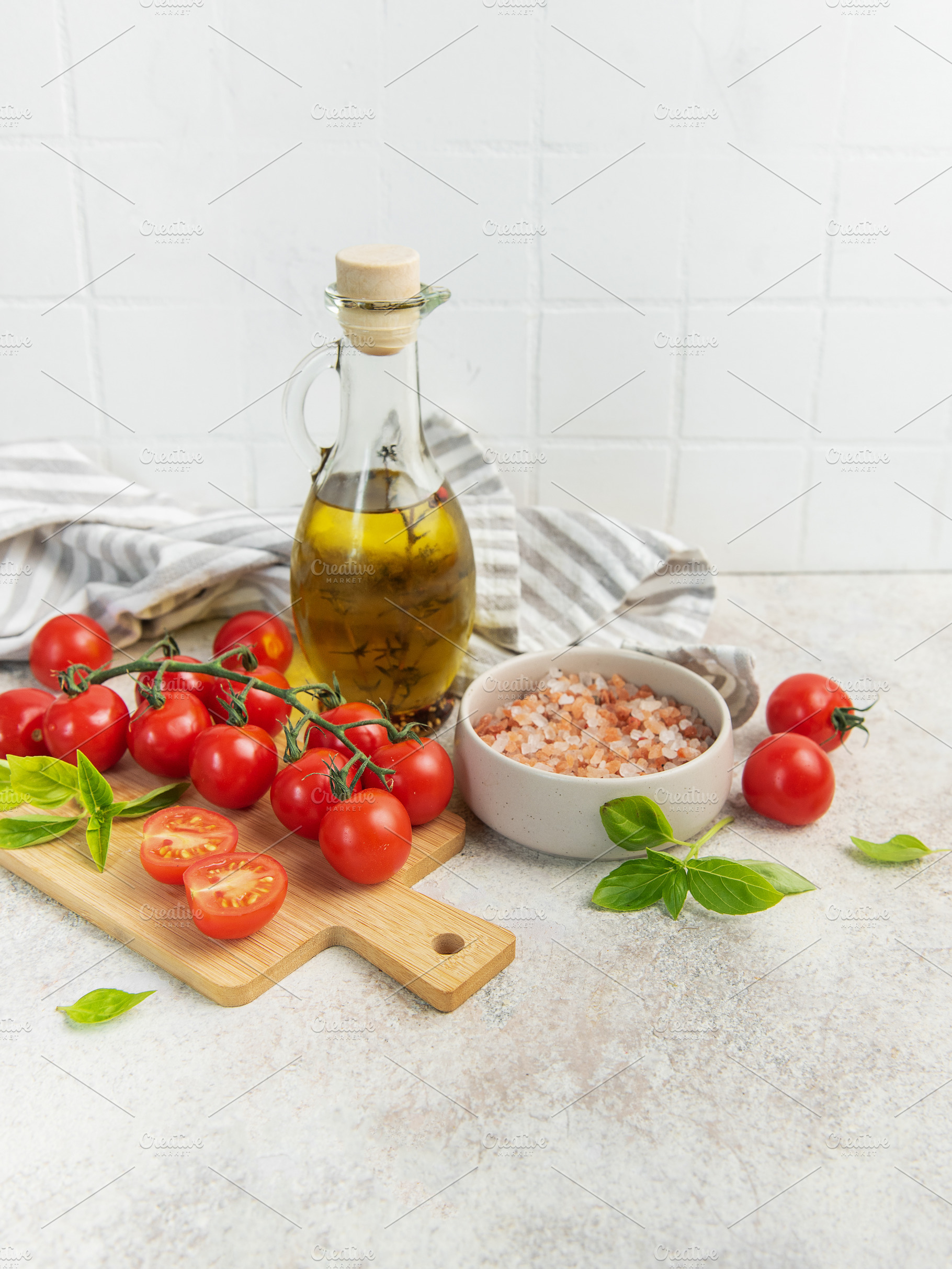 Fresh cherry tomatoes basil olive oil cooking ingredients, a Food & Drink Photo by Olena Rudo