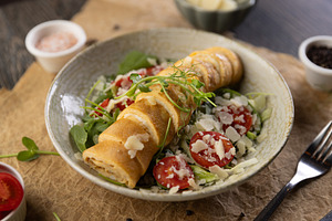 Roll omelette stuffed with chesse, a Photo by Grafvision photography