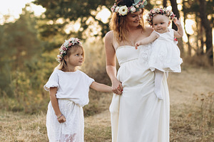 Mother and two beautiful daughters containing little, lovely, and greeting