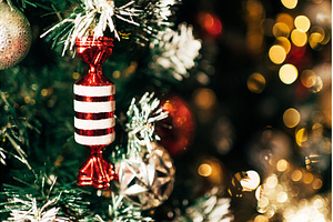 Red candy ornament hanging on, a Holiday Photo by Anna Efetova