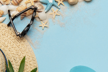 Beach accessories creating a summer holiday background with copy